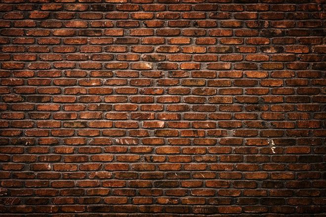 A close up of a brick wall with a lot of bricks