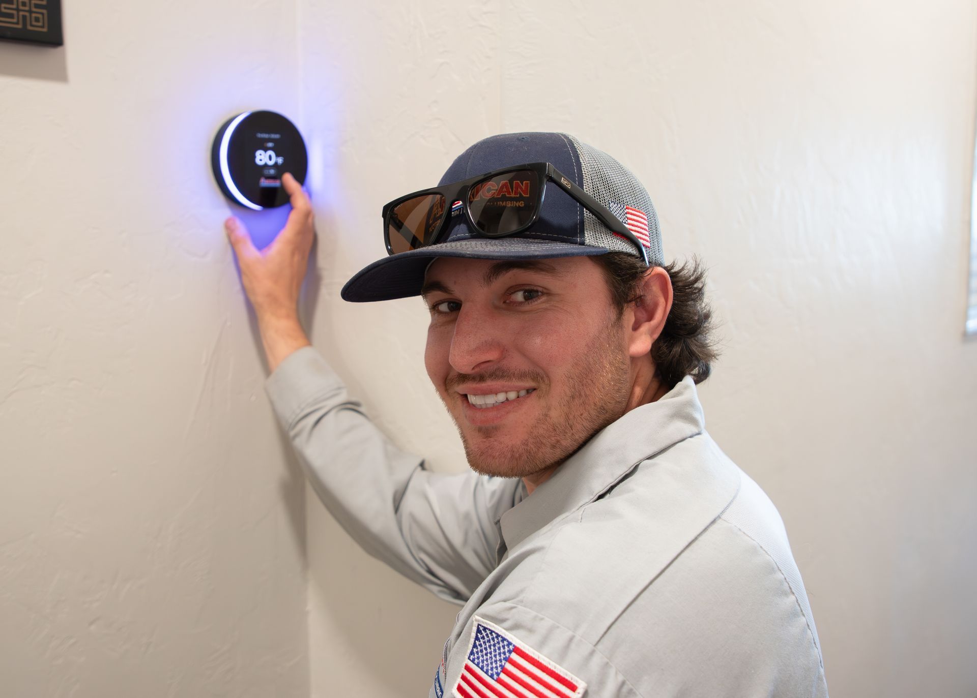 Technician installs EBreeze Smart Thermostat