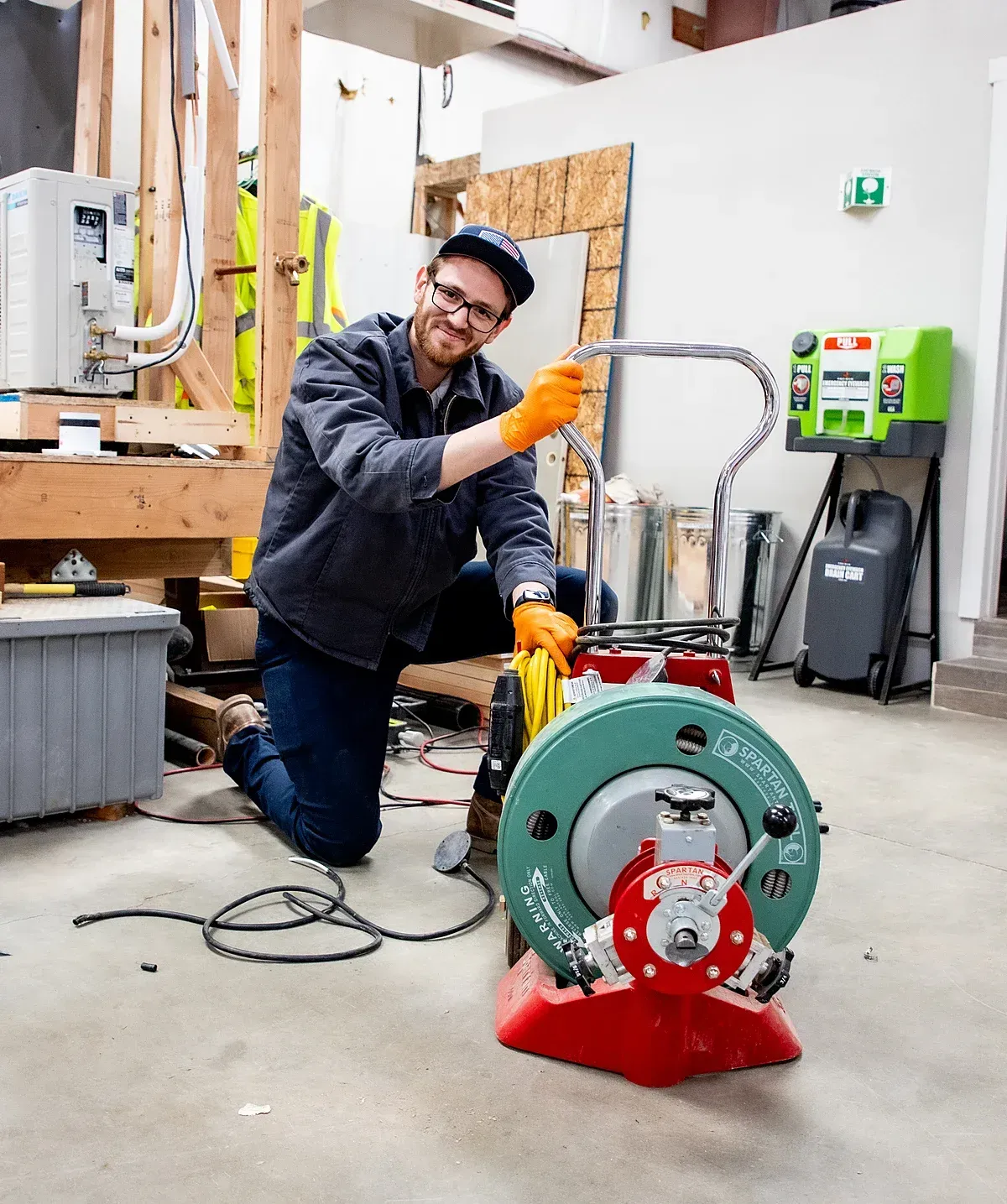 Professional Drain Tech with a drain snake