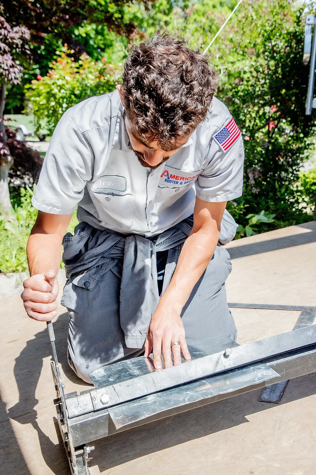 HVAC Technician cutting sheet metal