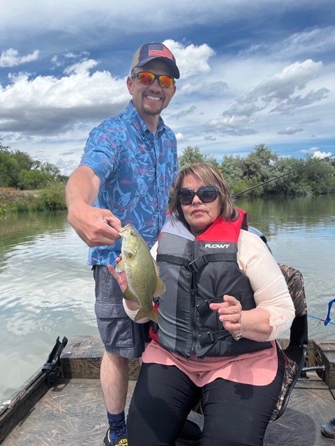Joshua Jordan and his mom fishing