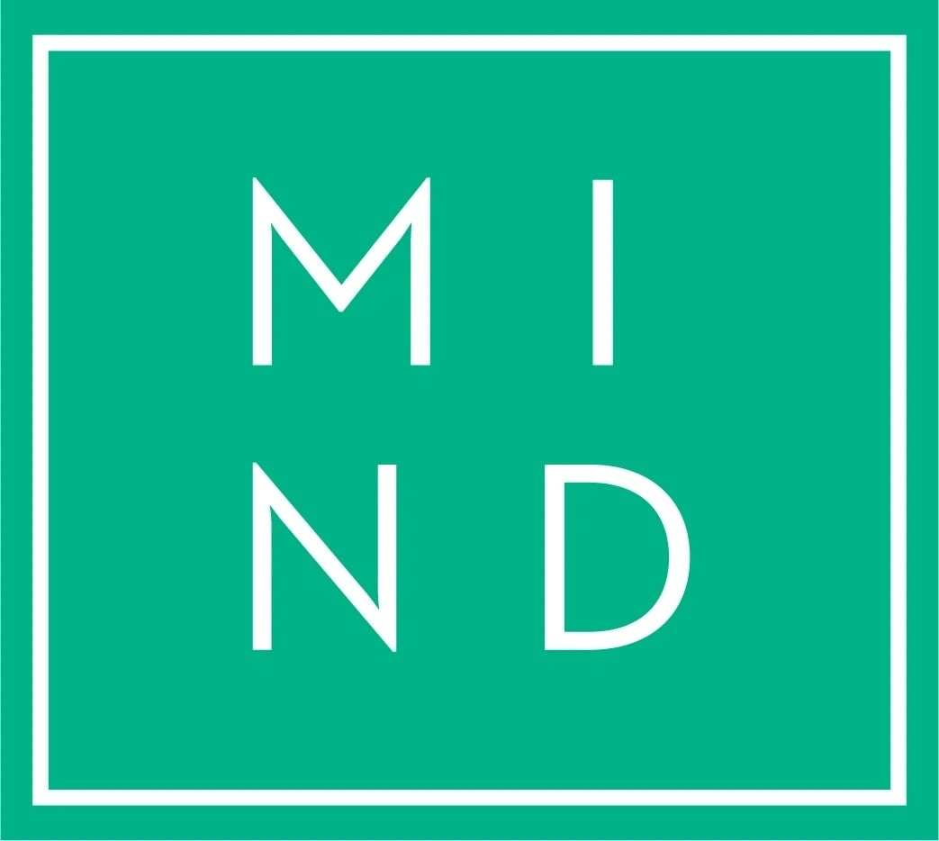 The logo for mi nd is a green square with white letters.
