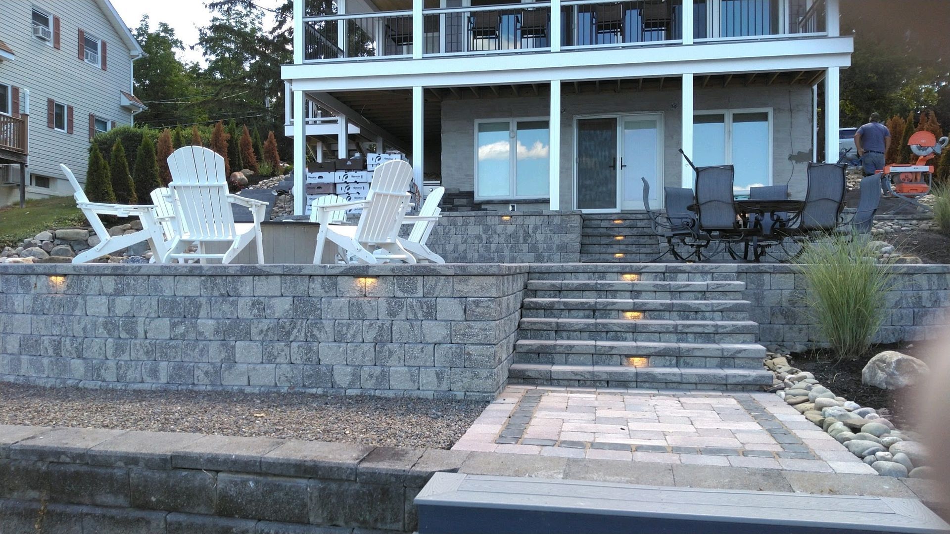 A large house with stairs leading up to it