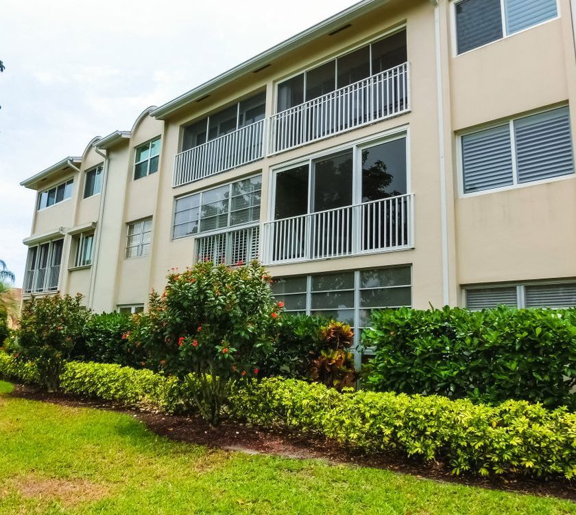 A large apartment building with lots of windows and balconies