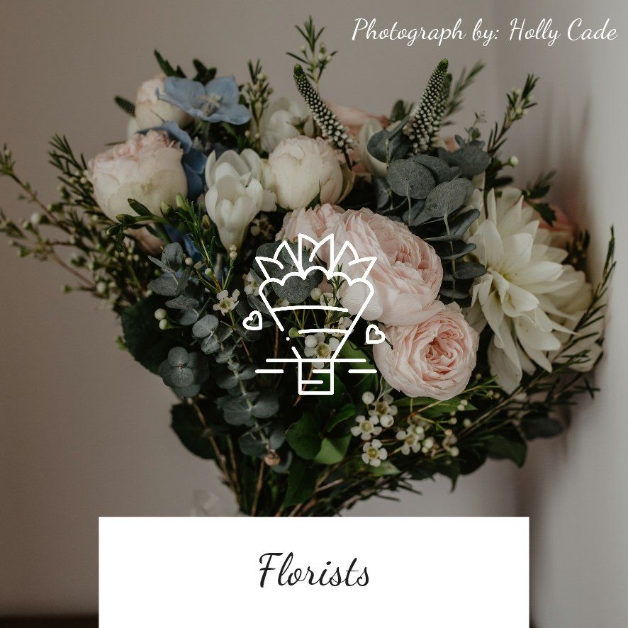 A bouquet of soft pink, white, and blue flowers;