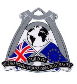 Guild of International Professional Toastmasters emblem: Globe, crossed flags (UK & EU), text on a silver shield.