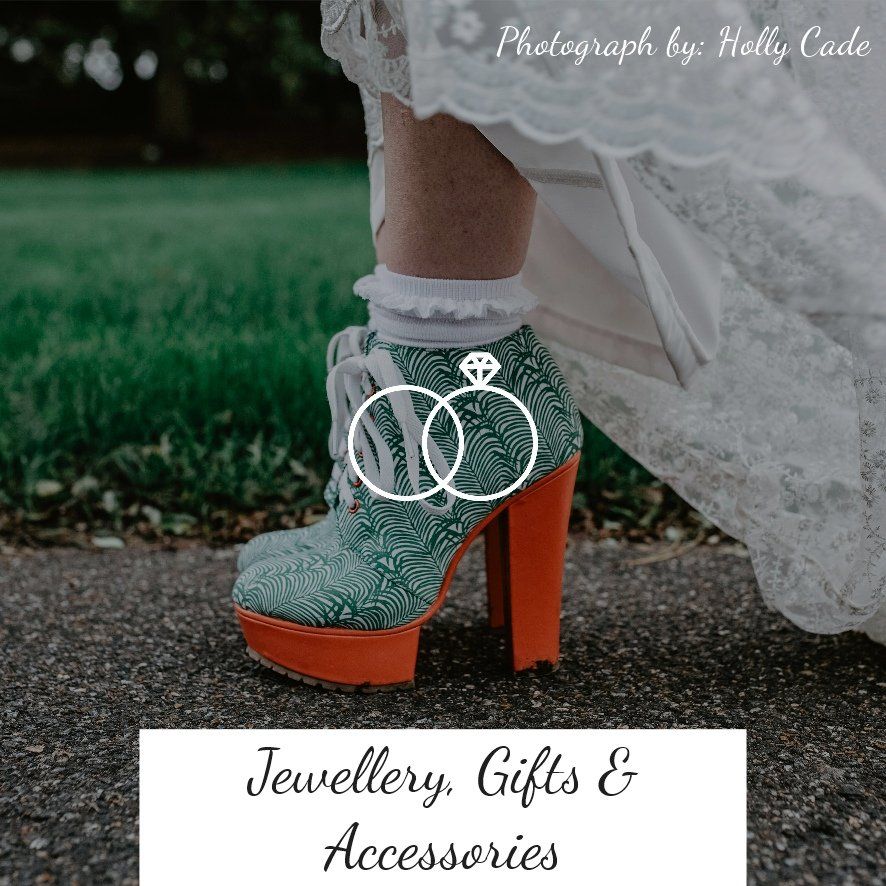 Bride's teal and orange heeled boots with lace dress, on a path. Jewelry and accessories.