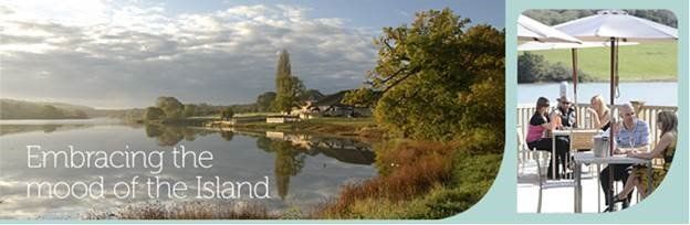 Lakeside scene with people at an outdoor cafe. Water, trees, and sky form the backdrop. Text reads