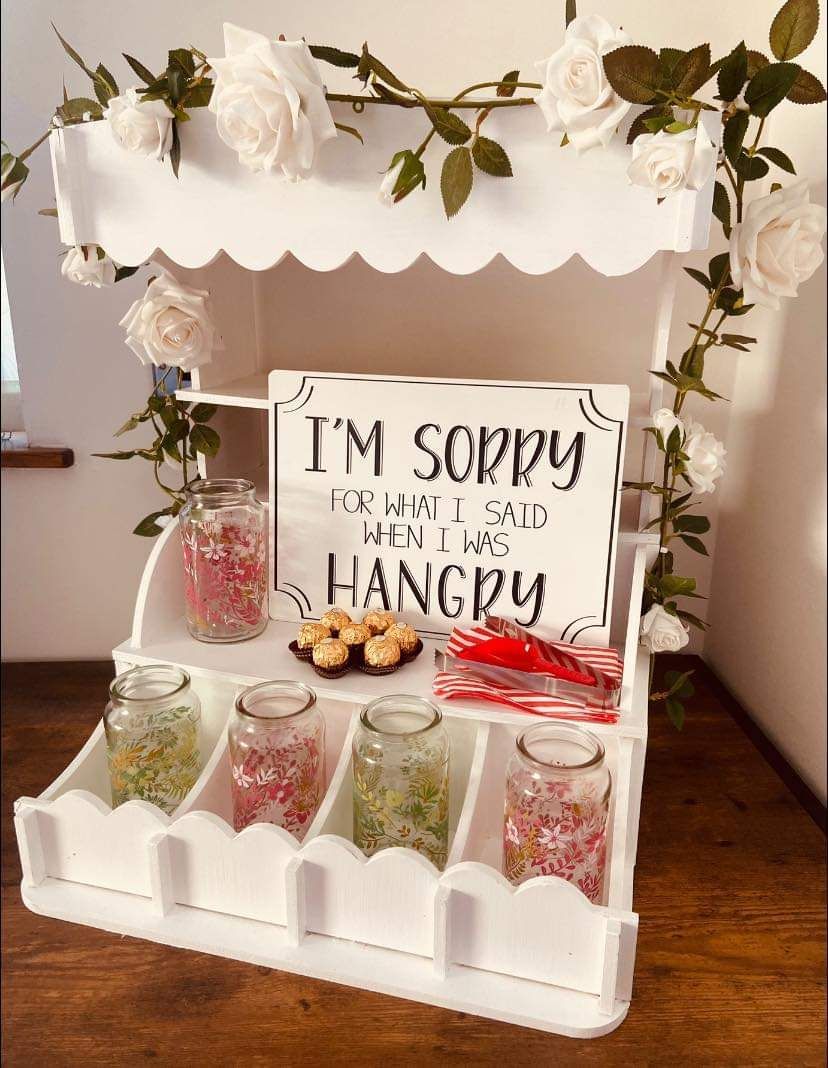 White dessert cart with sign reading