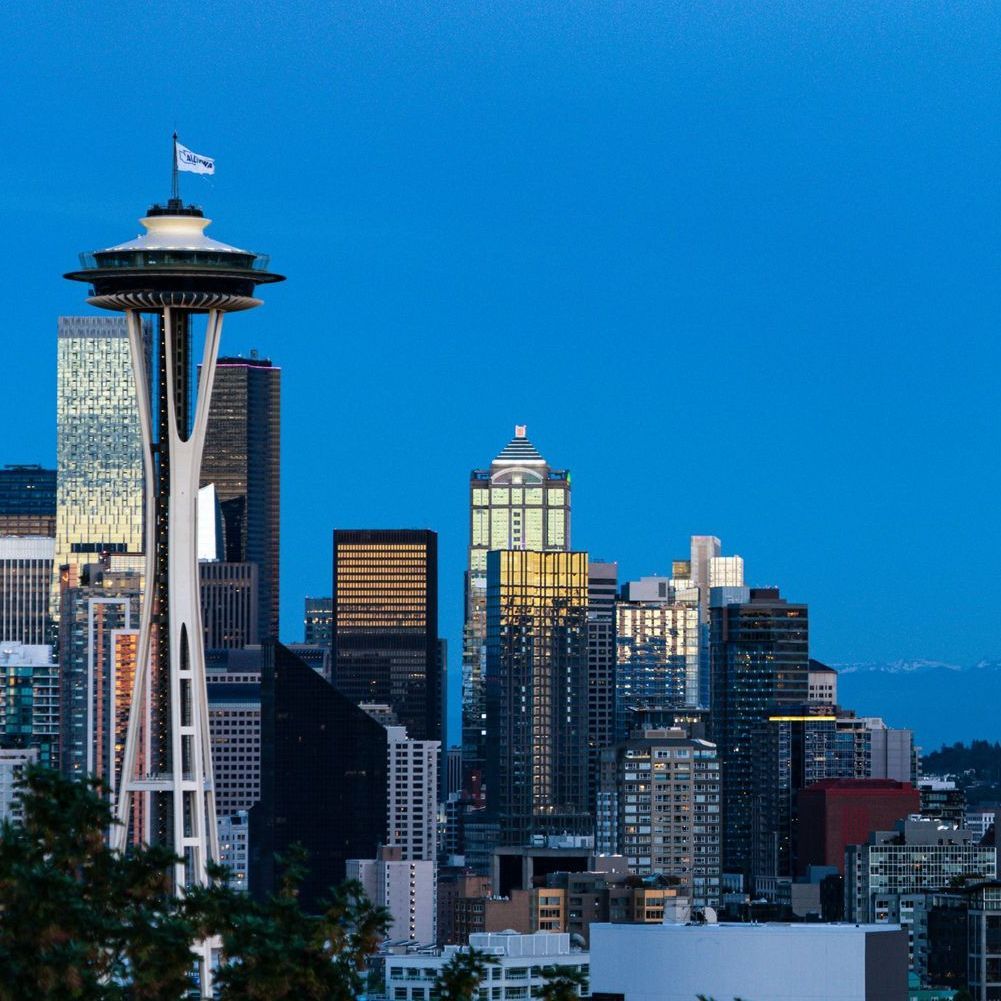 A city skyline with the space needle in the foreground