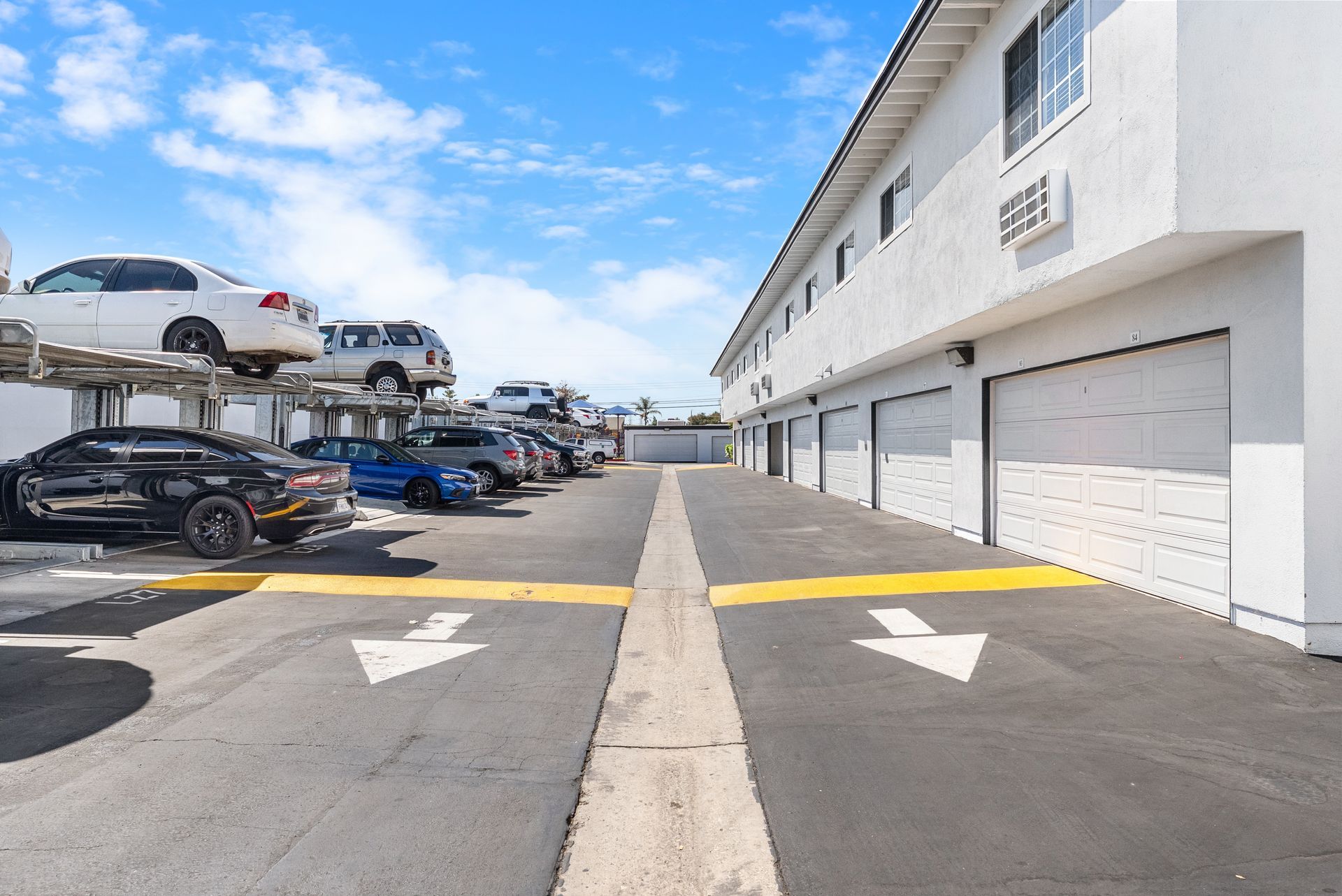 parking lot with garages and car lifts