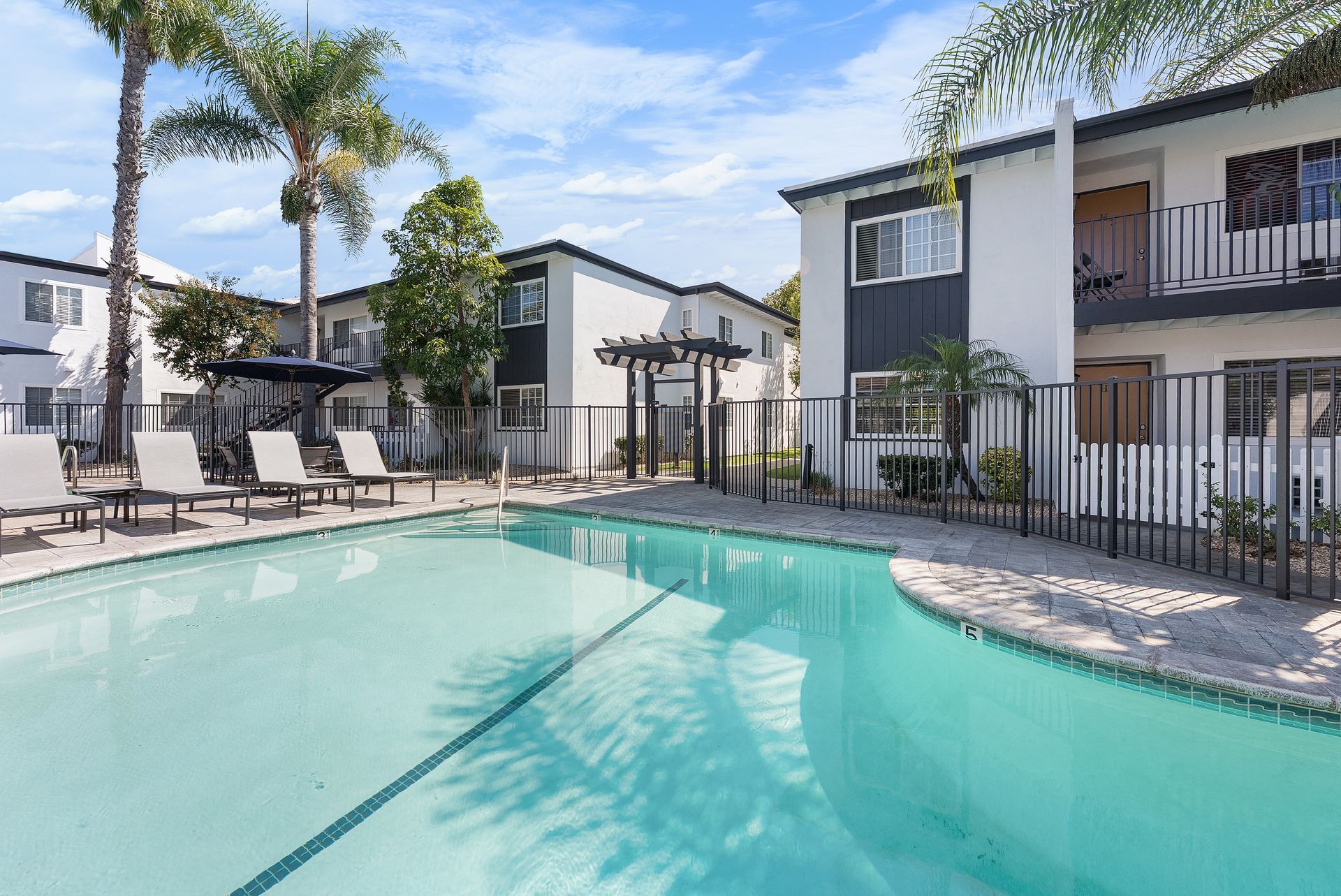 swimming pool with lounge chairs