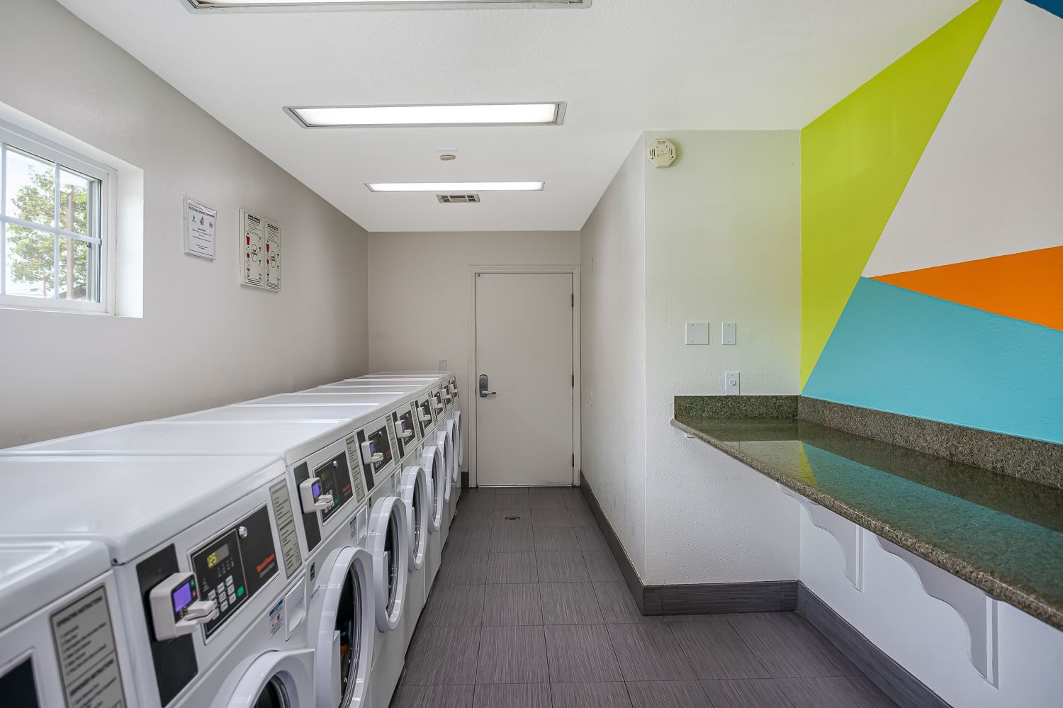 laundry room with machines and counter