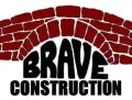 Brave Construction logo with black text beneath a red brick arch