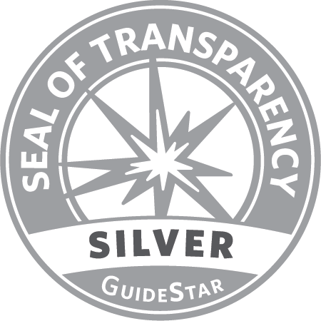 Silver Seal of Transparency from GuideStar. Circular design with a compass-like starburst and