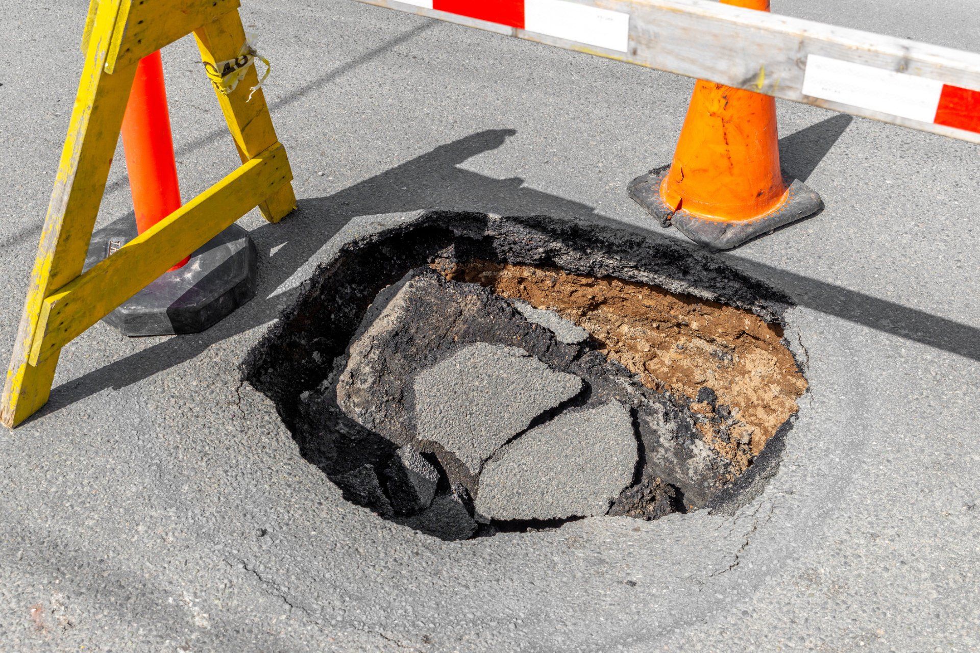 Big deep pothole - Wendell, NC - Champ's Paving & Seal Coating INC