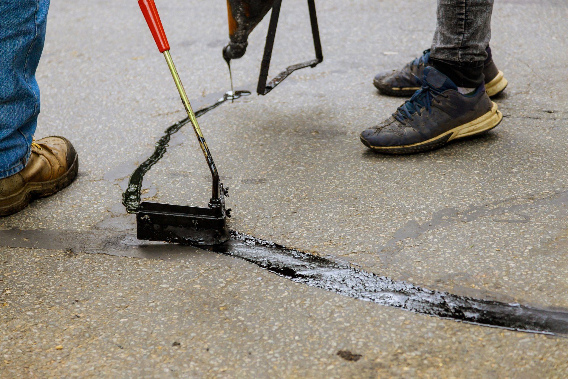 Commercial paving - Asphalt road with filled cracks repair in Wendell, NC
