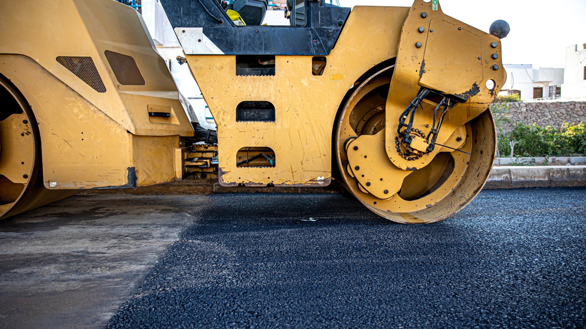 Road roller compacting asphalt - Wendell, NC l Champ's Paving & Seal Coating INC Road roller compacting asphalt - Wendell, NC l Champ's Paving & Seal Coating INC