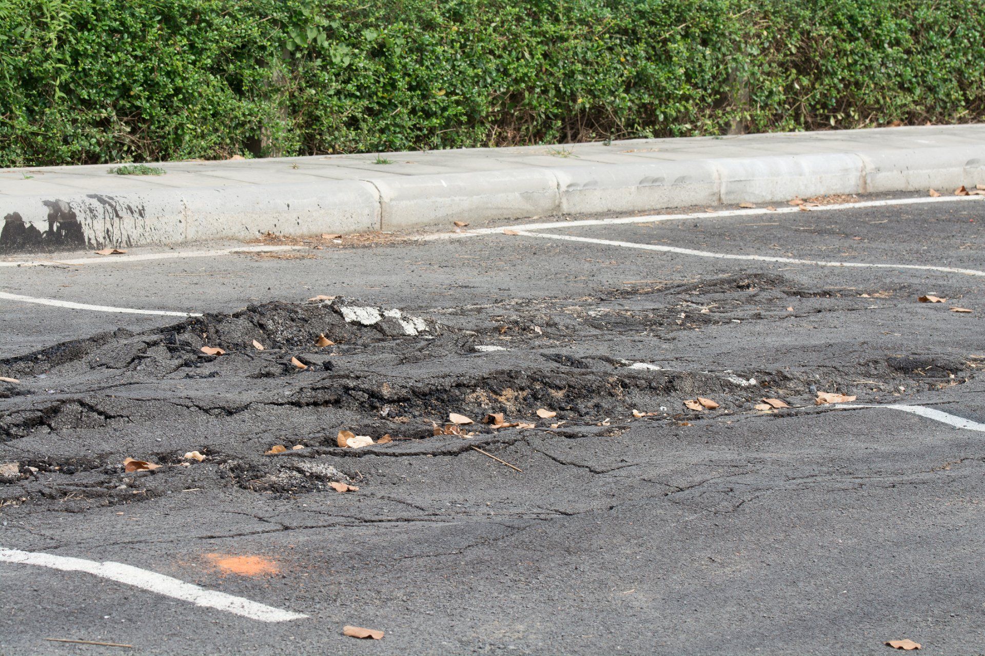 Asphalt surface poor construction - Wendell, NC - Champ's Paving & Seal Coating INC