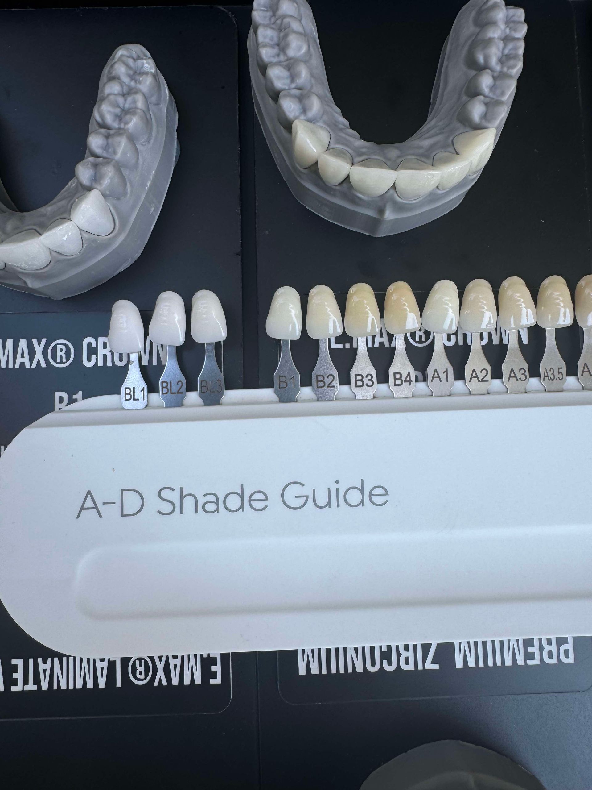 Dental shade guide with tooth molds, comparing teeth shades from light to dark.