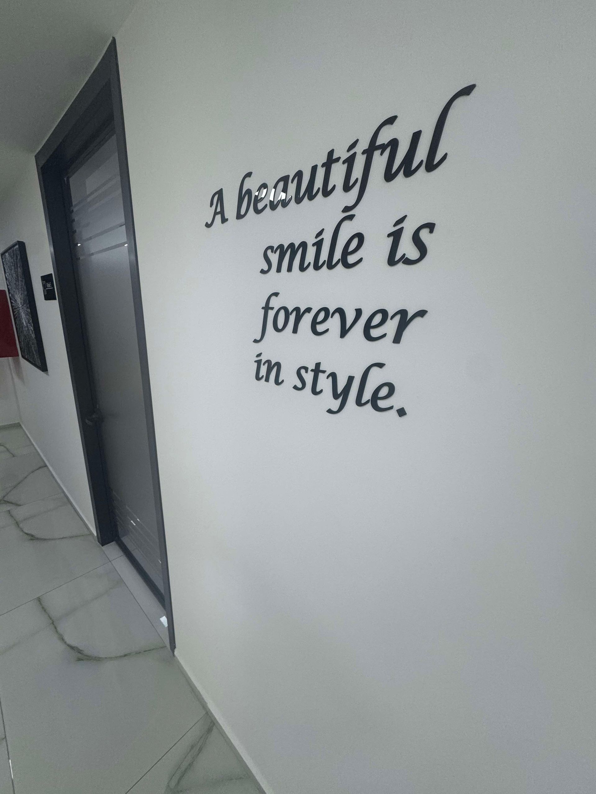 White wall with black text: 