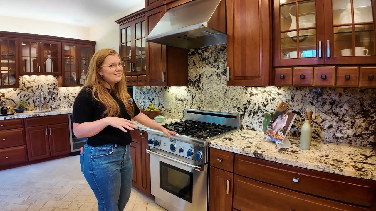 Kitchen with shaker cabinets, granite counters and a Thermador gas range in a Redwood City home