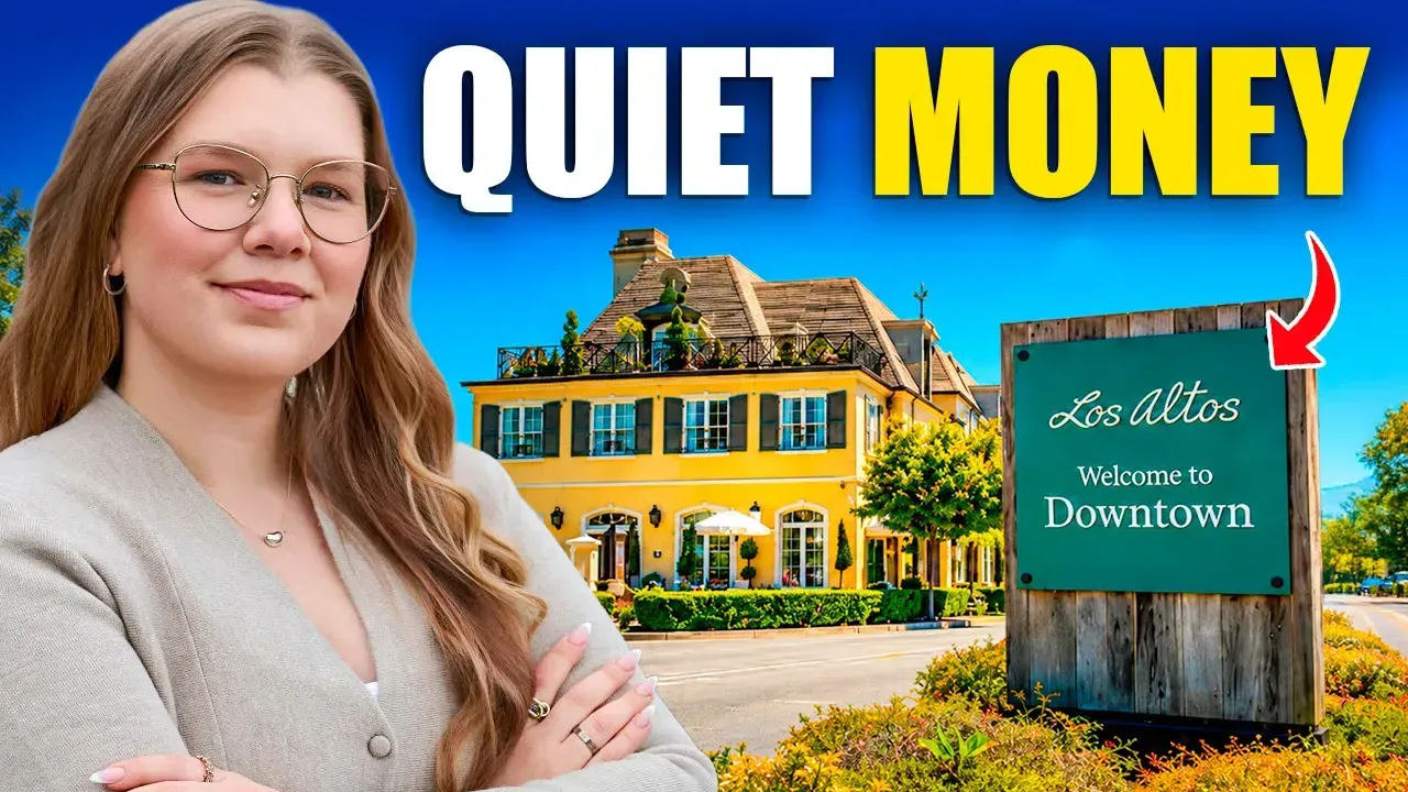 Woman in glasses beside yellow house and sign reading “Quiet Money” and “Downtown”