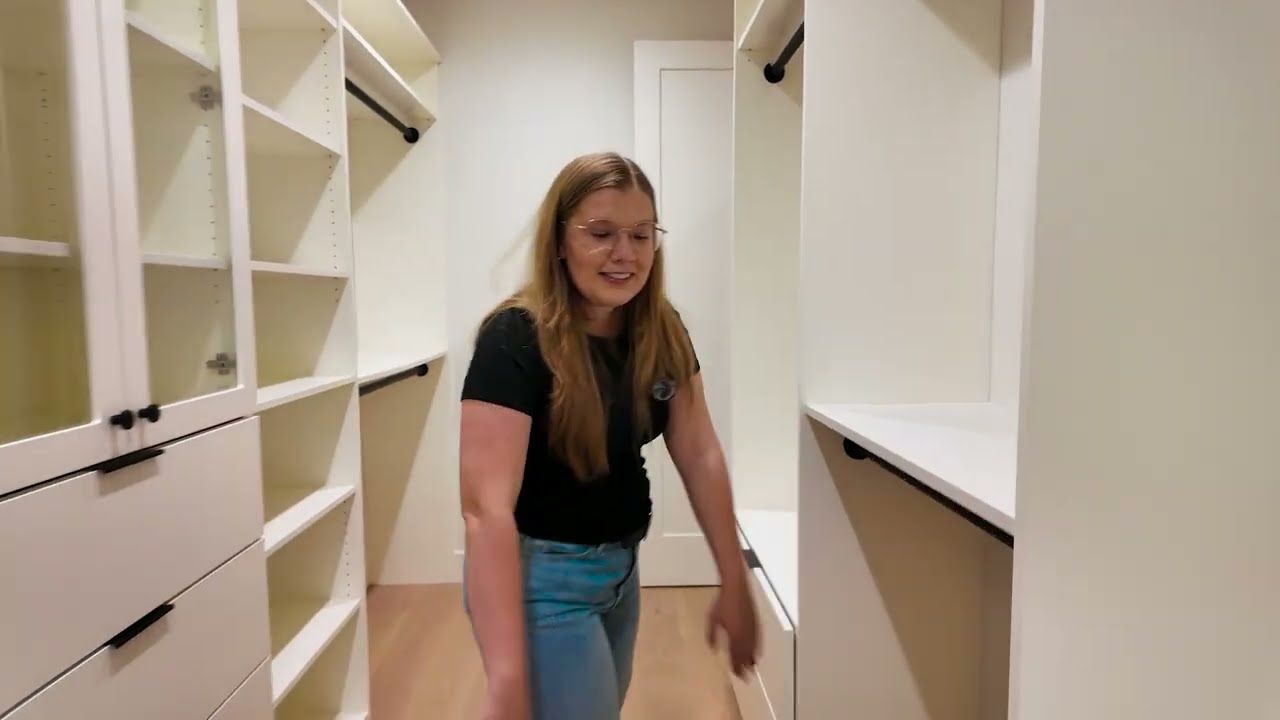 Large walk-in closet with custom built-ins in the primary suite of a new Menlo Park home
