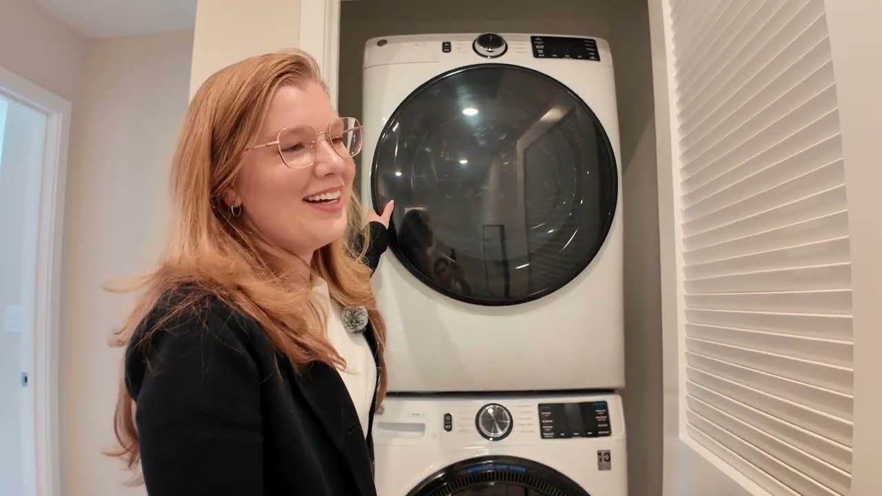 Full-size stacked washer and dryer on the top floor of a new Mountain View townhome