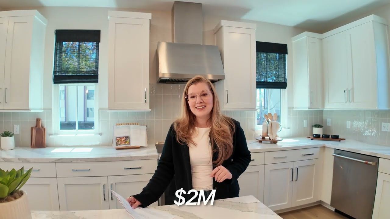 Bright white kitchen with a quartz island in a new construction townhome in Mountain View, California