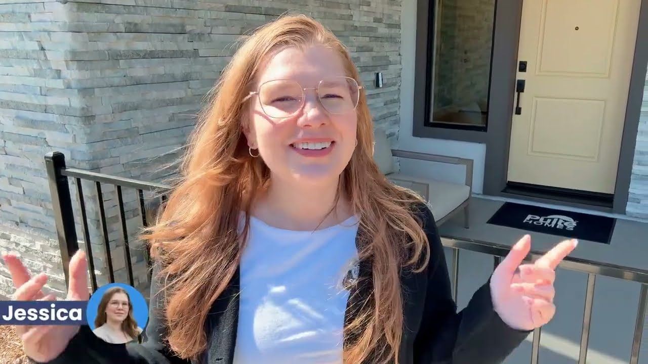 Jessica Heredia at the entry of the Elevate Plan 1 model home at The Heights in San Mateo, CA
