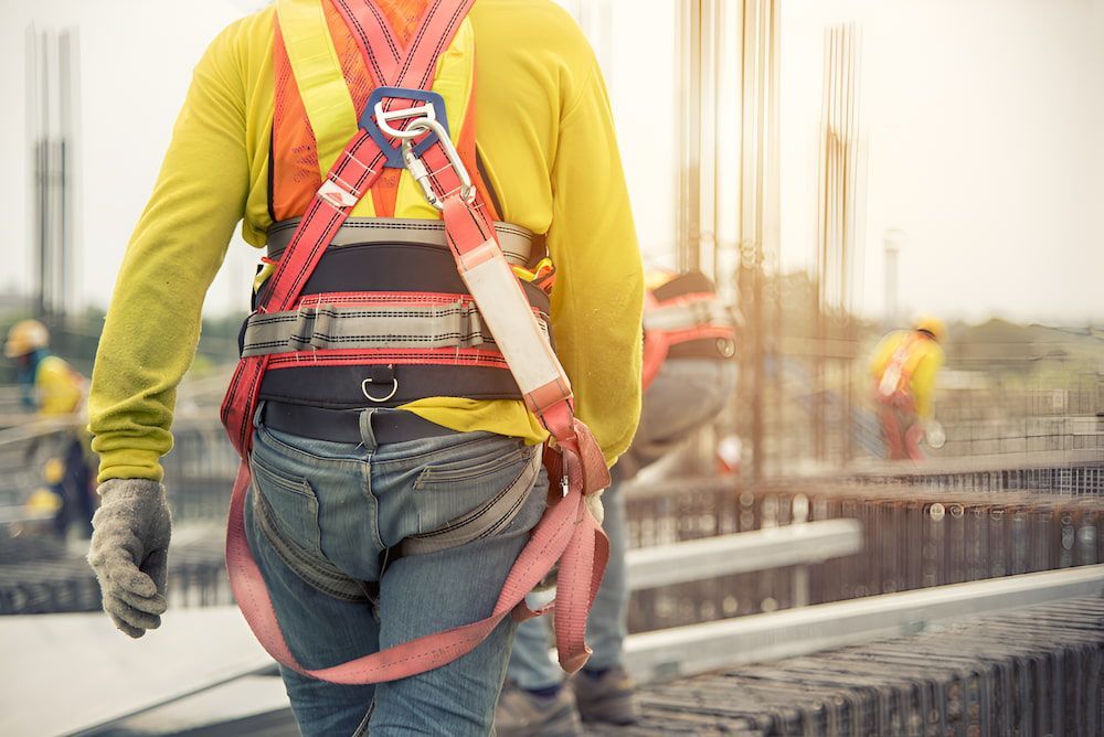 A Construction Worker Wearing A Safety Harness — Macquarie Valley Rock & Sand In Narromine, NSW