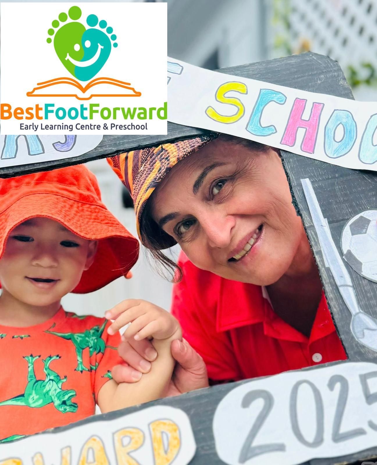 Woman and child smiling in front of a school-themed backdrop with the BestFootForward logo.
