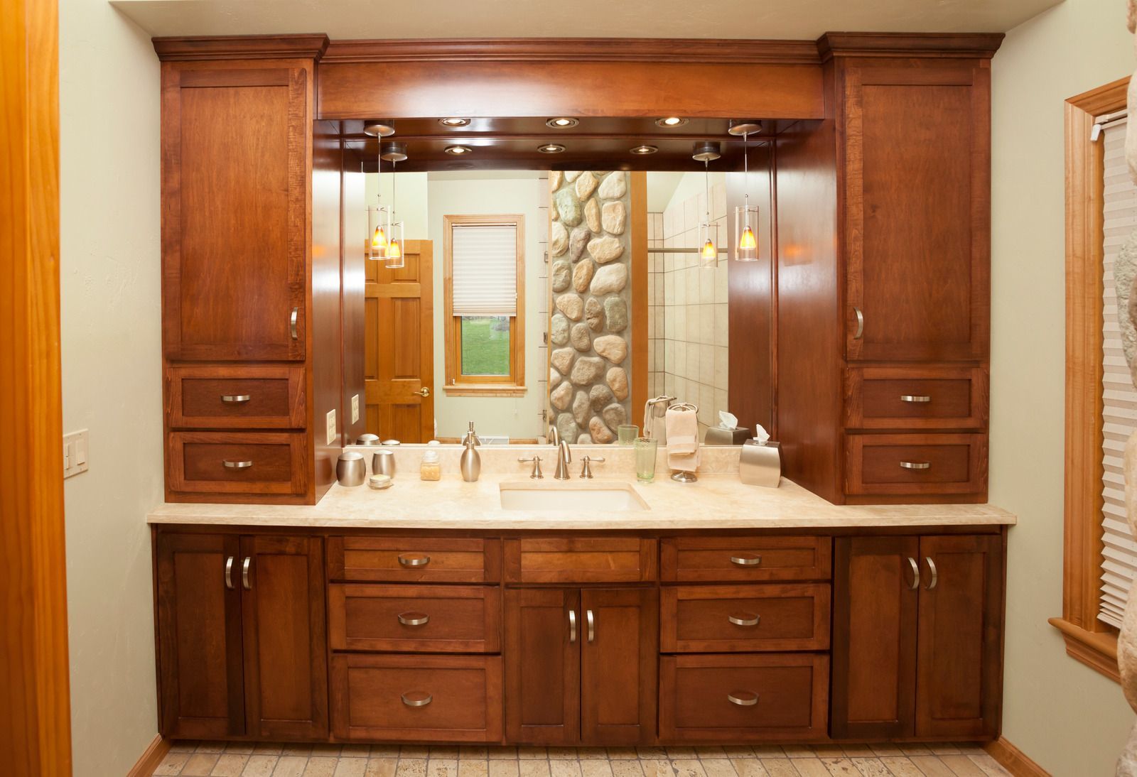 A bathroom with two sinks and a large mirror