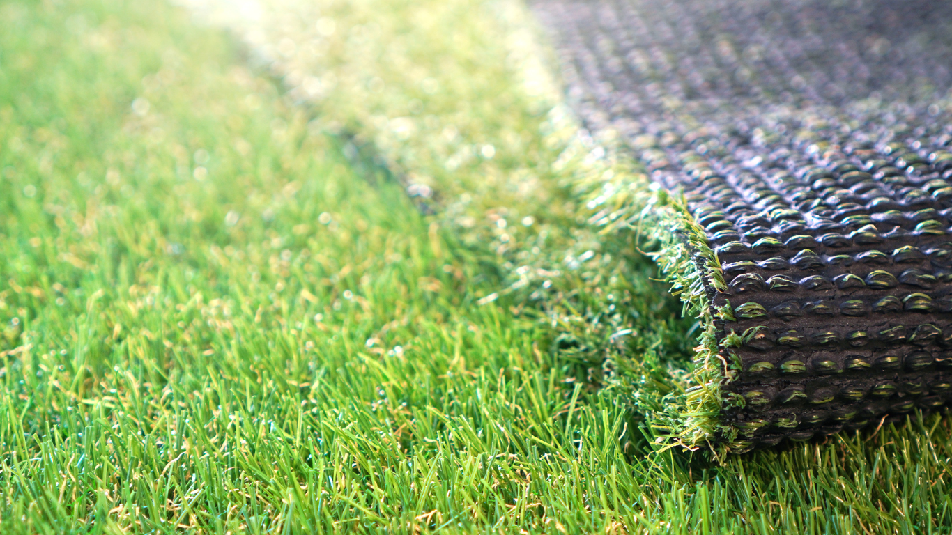 a close up of a roll of artificial grass