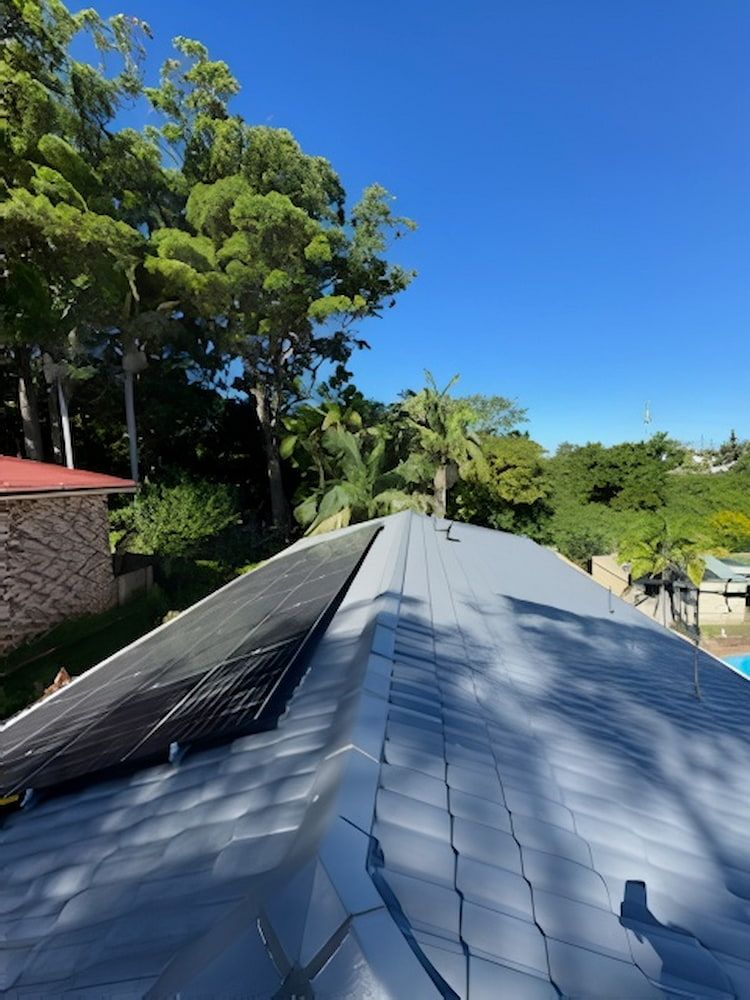 A Roof With a Lot of Solar Panels on It — Cornall Painting Services in Kempsey, NSW