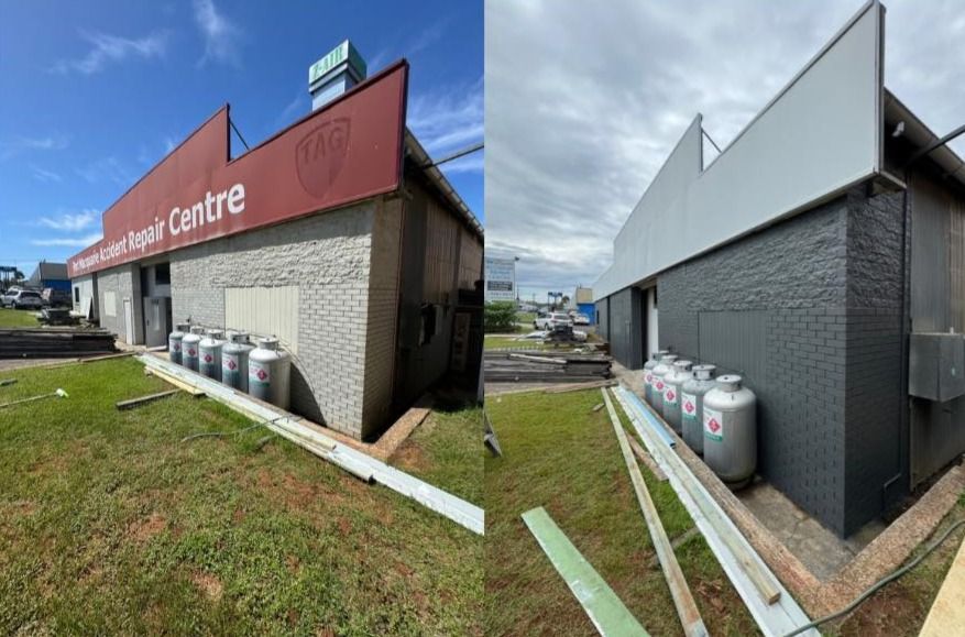 Commercial Building With Roller Door and Ladders — Cornall Painting Services in Wauchope, NSW 