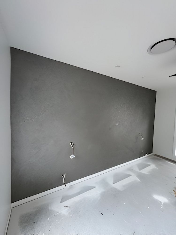 An Empty Room With a Gray Wall and a White Floor — Cornall Painting Services in Laurieton, NSW