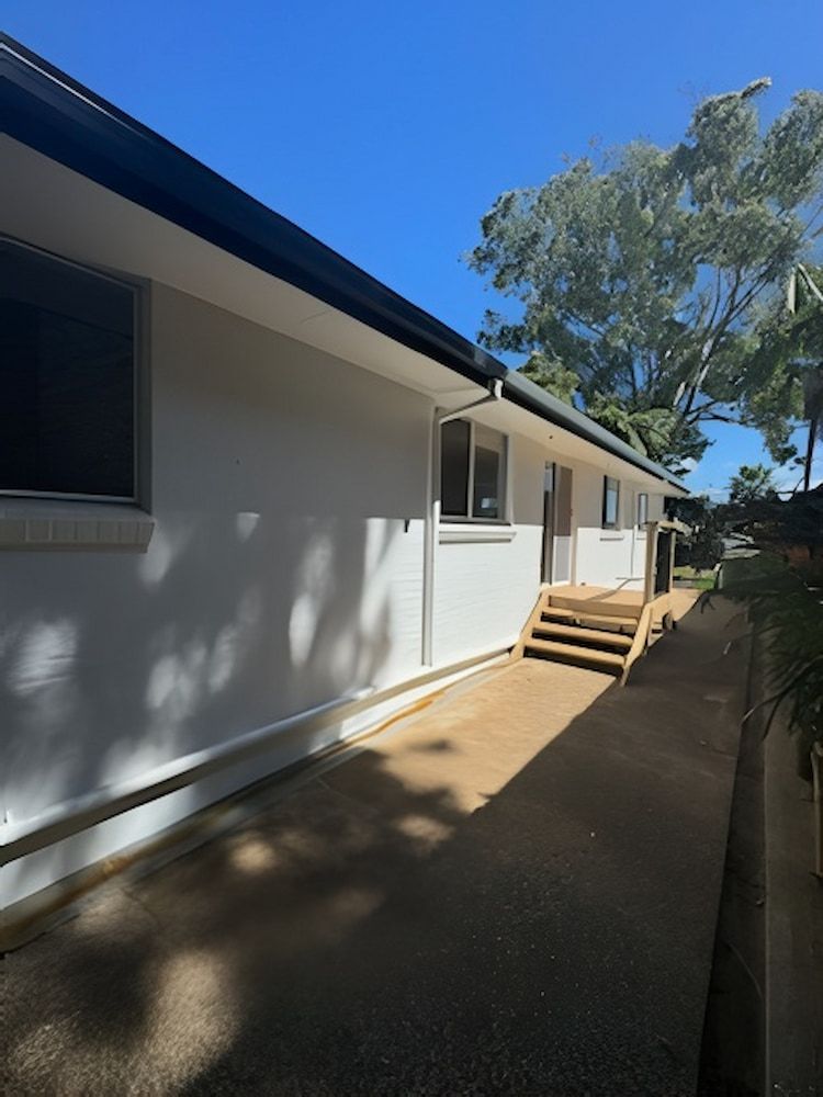 A White House With Stairs Leading Up to It — Cornall Painting Services in Kempsey, NSW