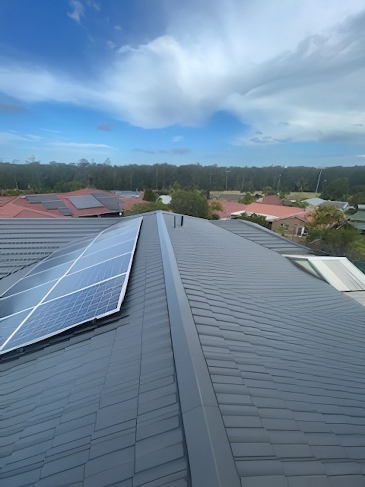 A Roof With a Lot of Solar Panels on It — Cornall Painting Services in Laurieton, NSW