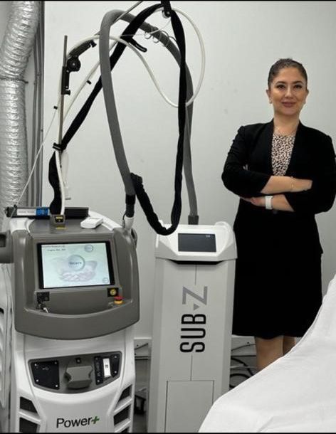 Elham Vasmeh stands in front of a sub-z machine