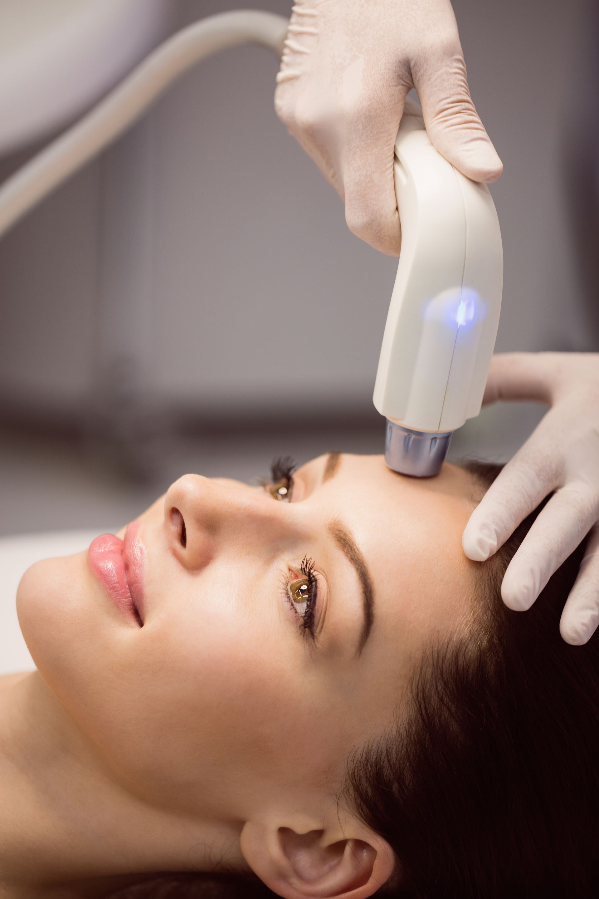 a woman is getting a facial treatment at a beauty salon .