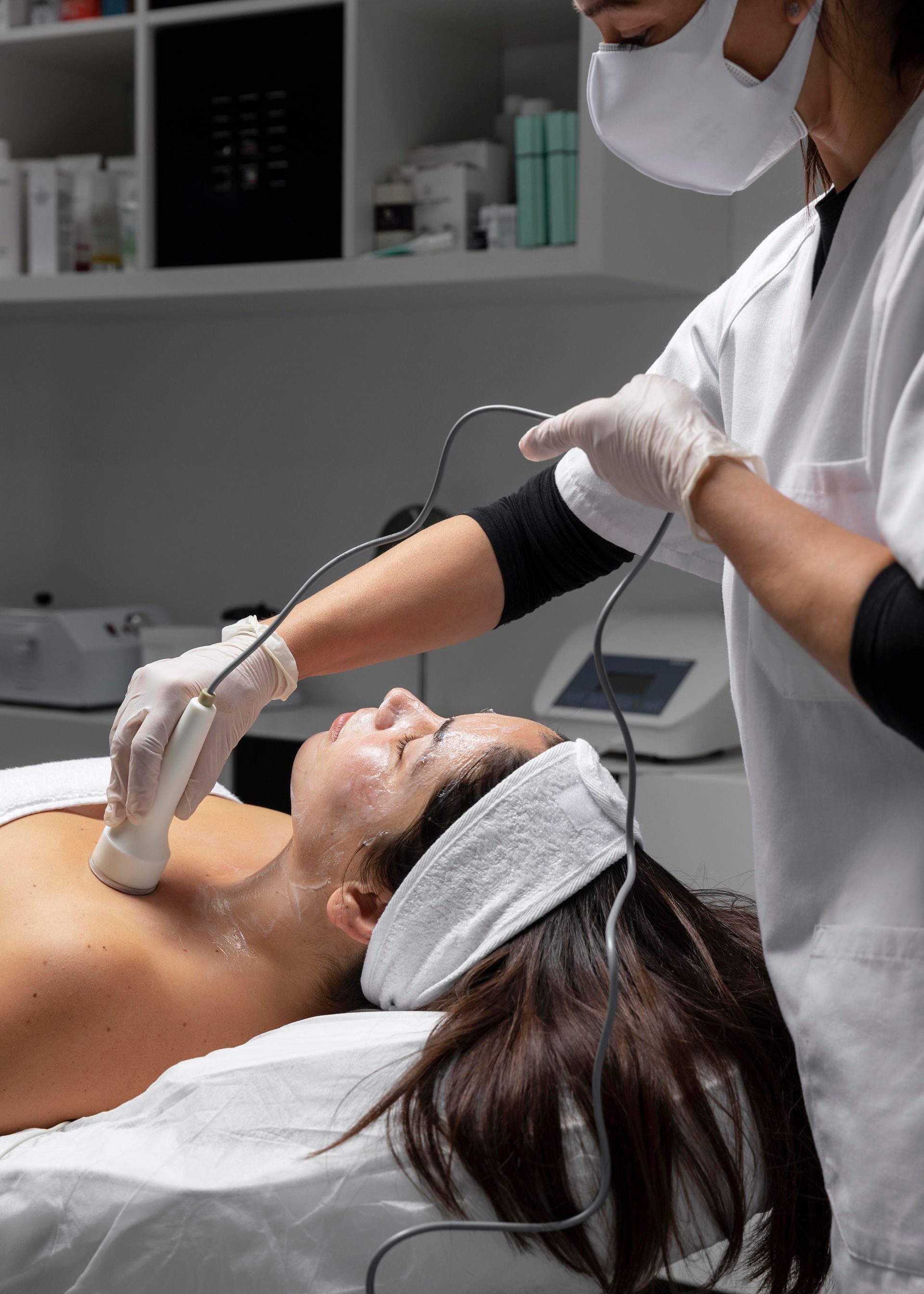 a woman is getting a facial treatment at a beauty salon .