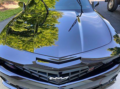 mirror finish white mercedes parked in the auto this world facility