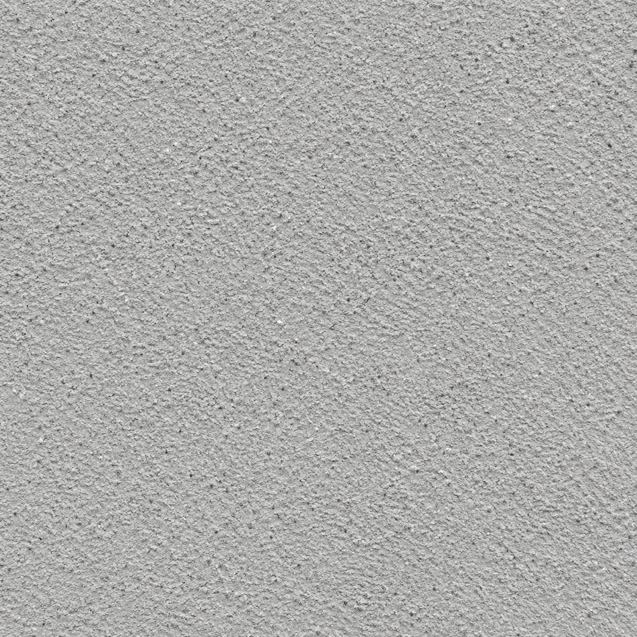 A close up of a gray surface with black spots