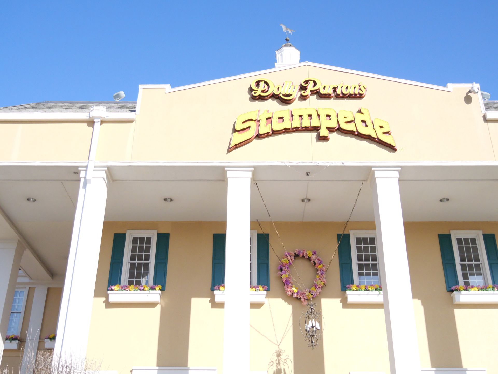 The front of a building that says stampede on it