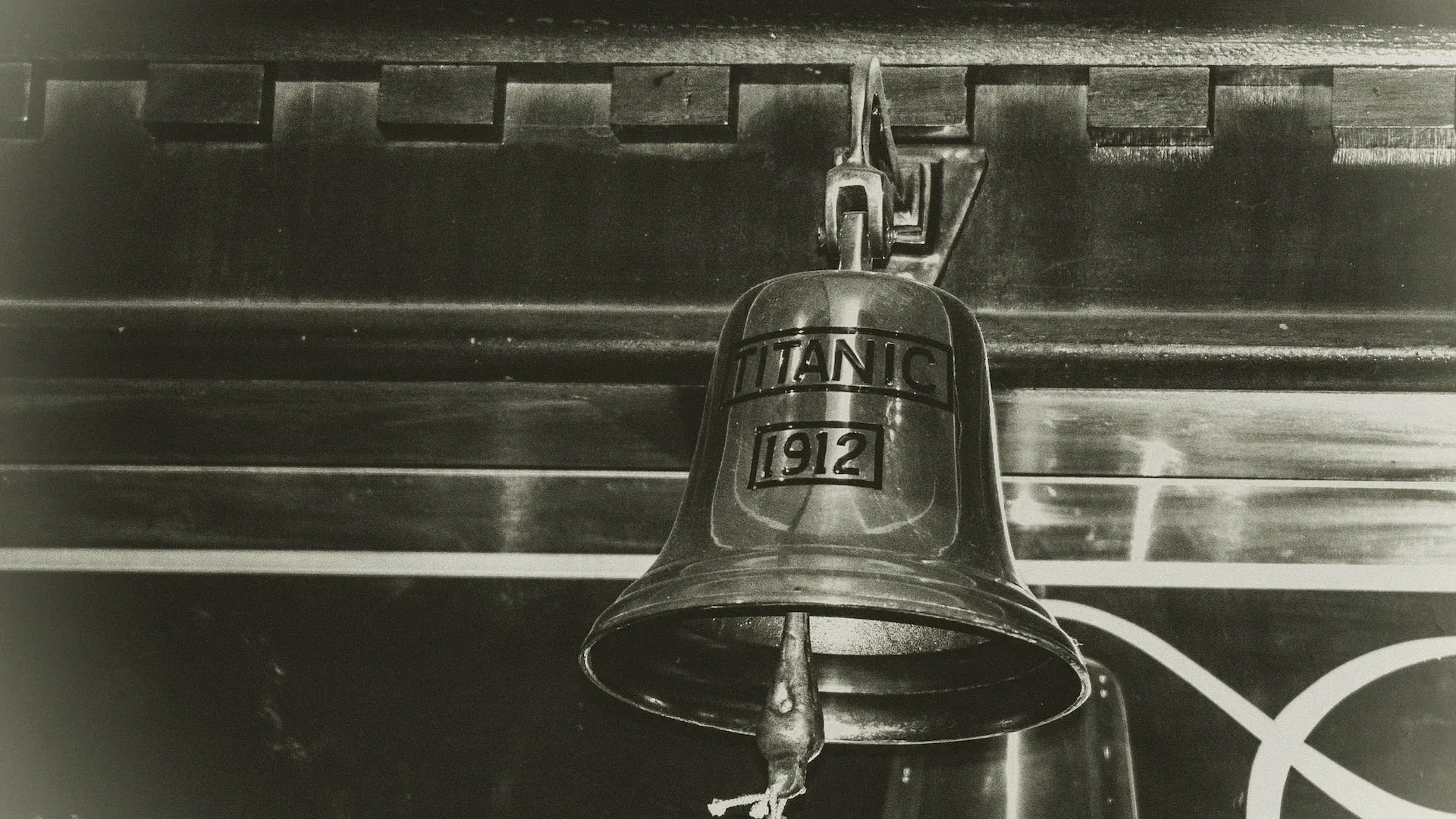 A black and white photo of a titanic 1912 bell