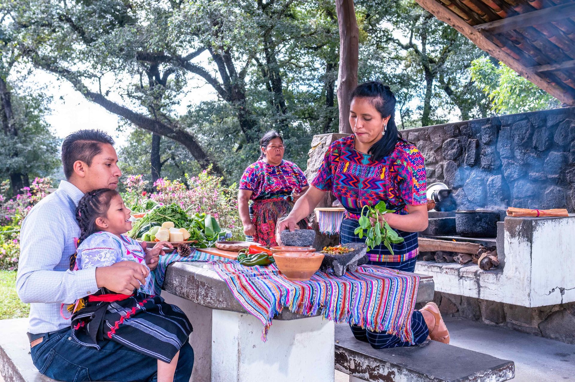 A family enjoying a meal at their Outdoor Kitchen
