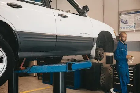 Car undergoing inspection and repair service at Arnold’s Auto Repair near Brunswick NJ