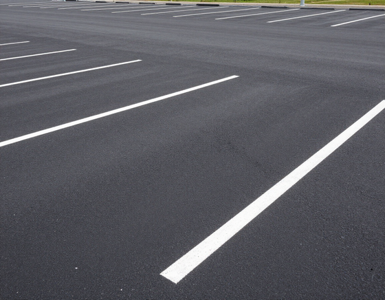 Commercial parking lot surfaced with asphalt supplies from First Choice Paving